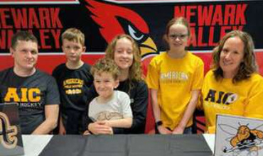 Day and family at signing