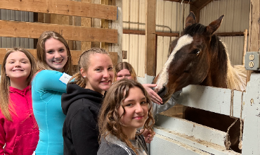 Five students and a horse