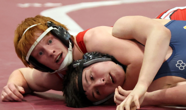 NV wrestler pins another wrestler on mat