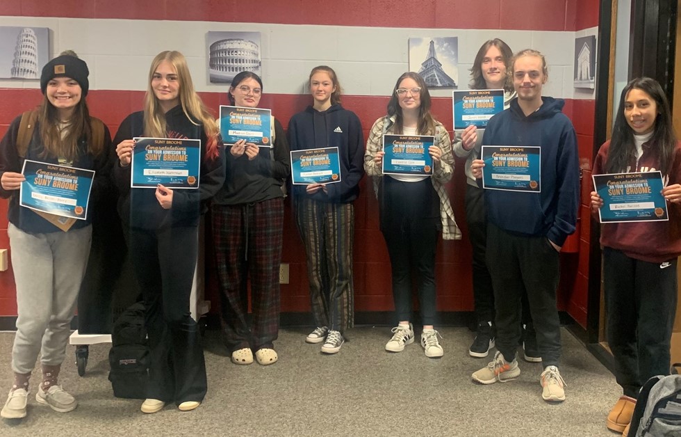 students smiling after getting accepted into SUNY Broome