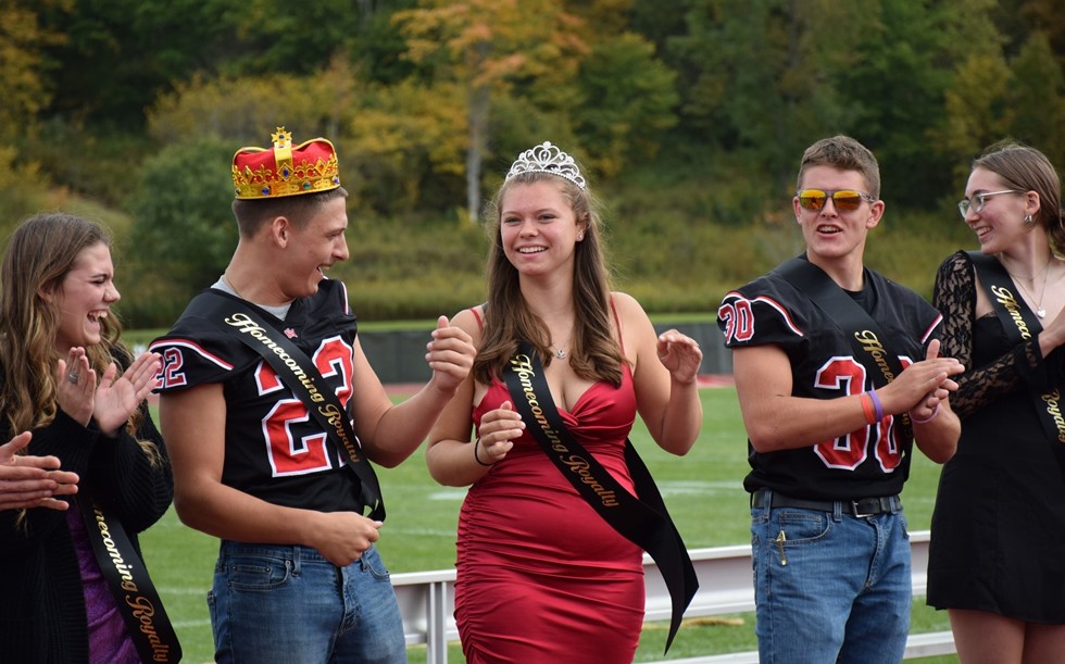 Homecoming King and Queen smiling for a picture at the 2023 Homecoming pep rally