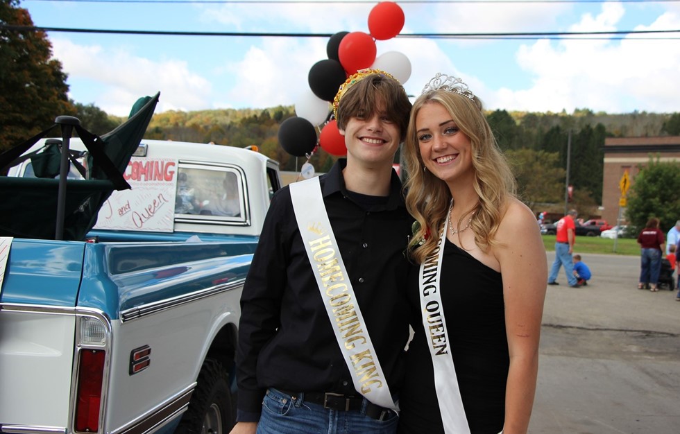 Homecoming king and queen outside