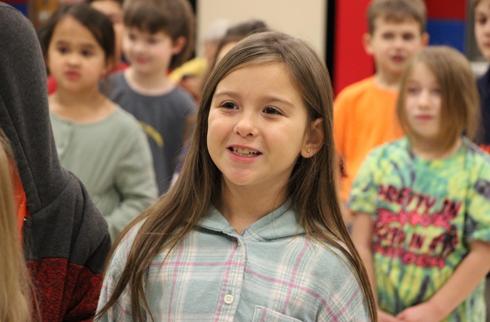 Students smiling and singing