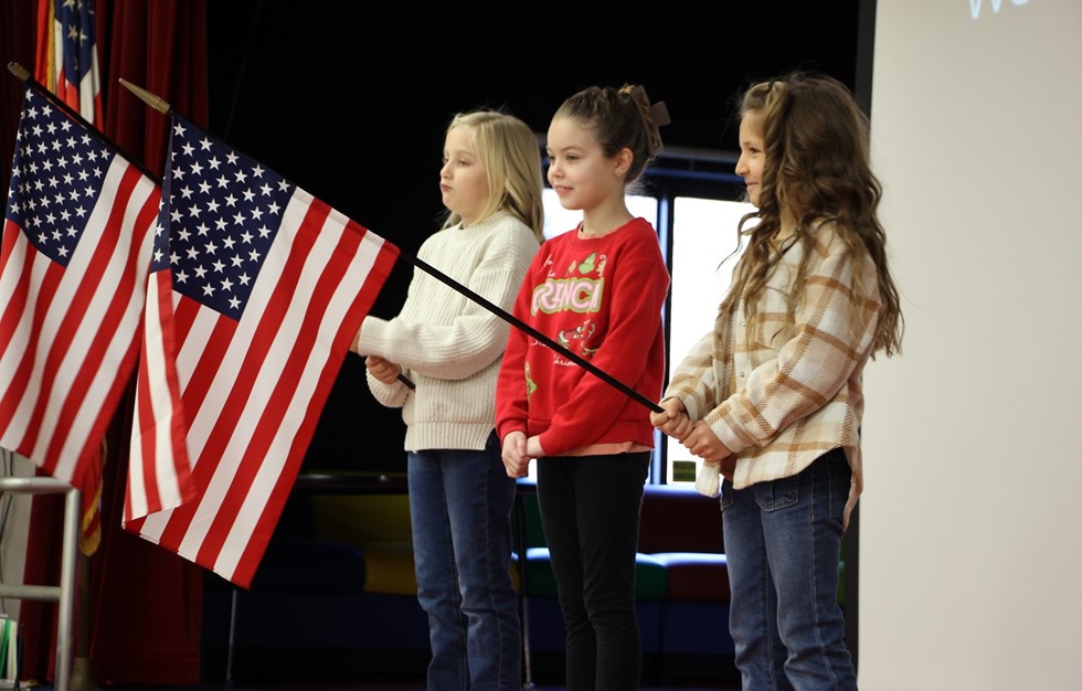 Three students with flags