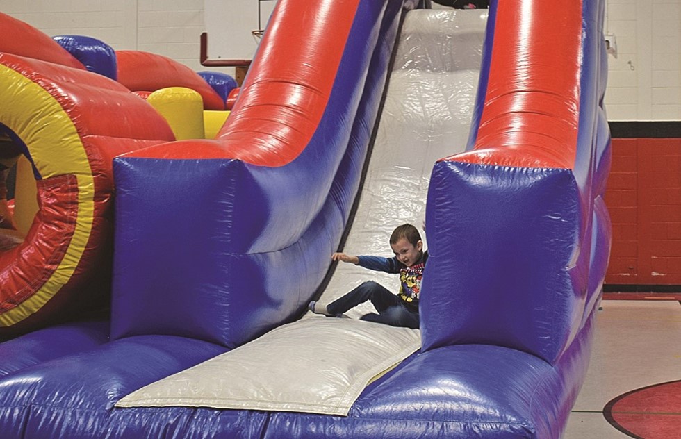 student on bouncy house