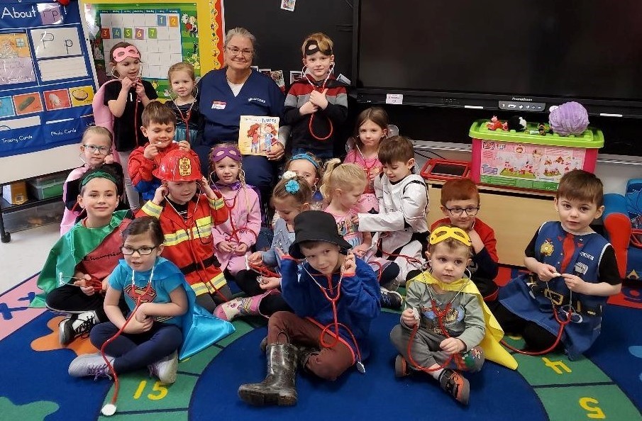 Students Dressed up reading a book 