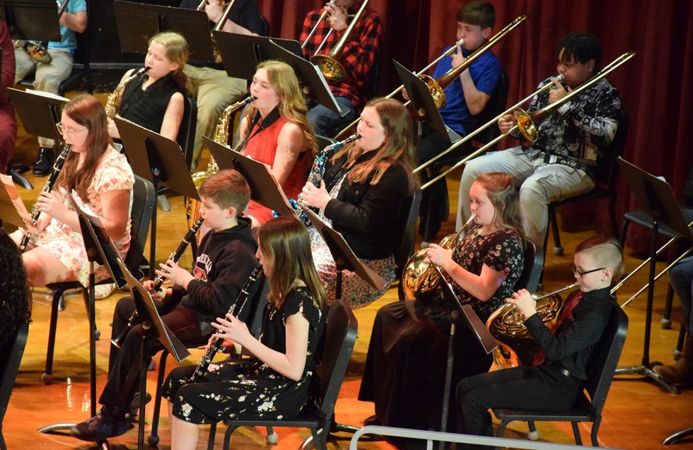 students performing in a band concert 