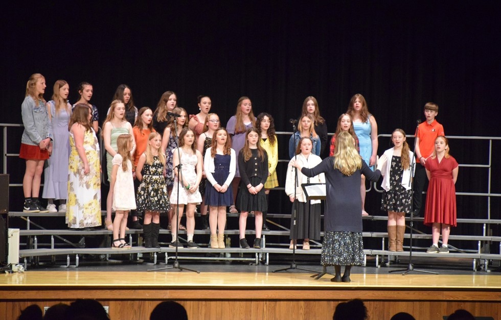 Students singing in a chorus concert