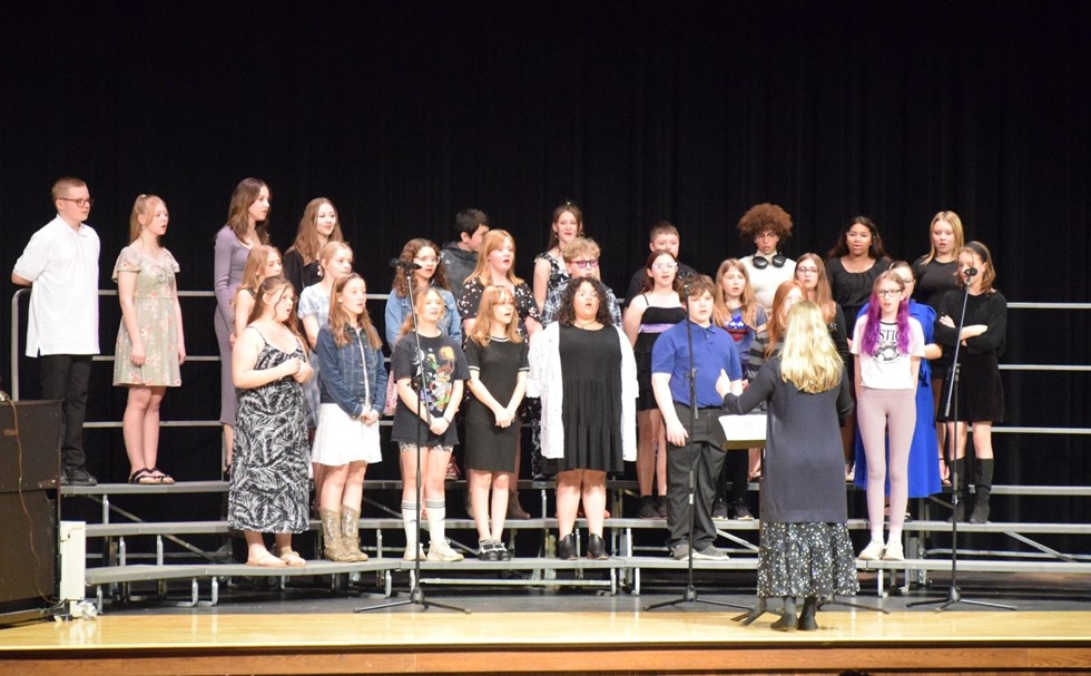 Students singing in a chorus concert