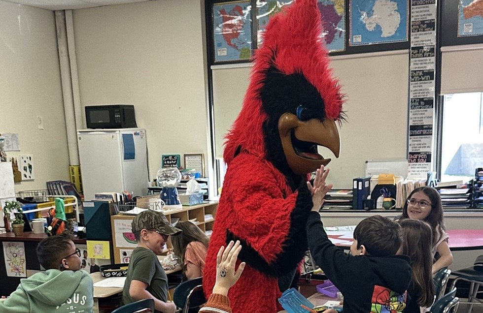 Newark Valley Cardinal Mascot Giving Students a High-Five 