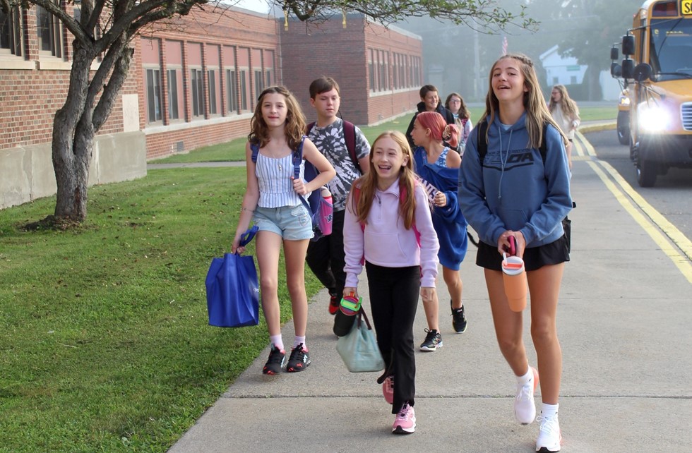 Students walking off bus on first day