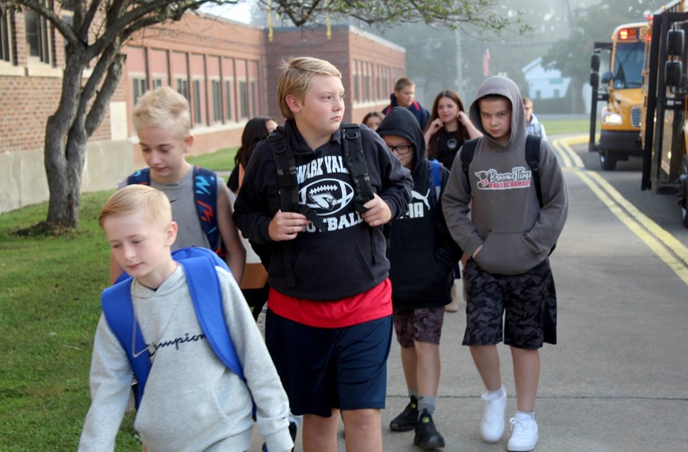 Kids getting off bus on first day