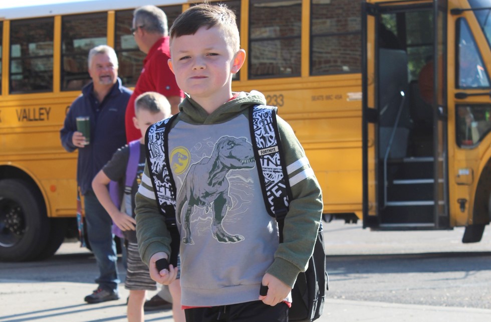 Kids getting of school bus on first day