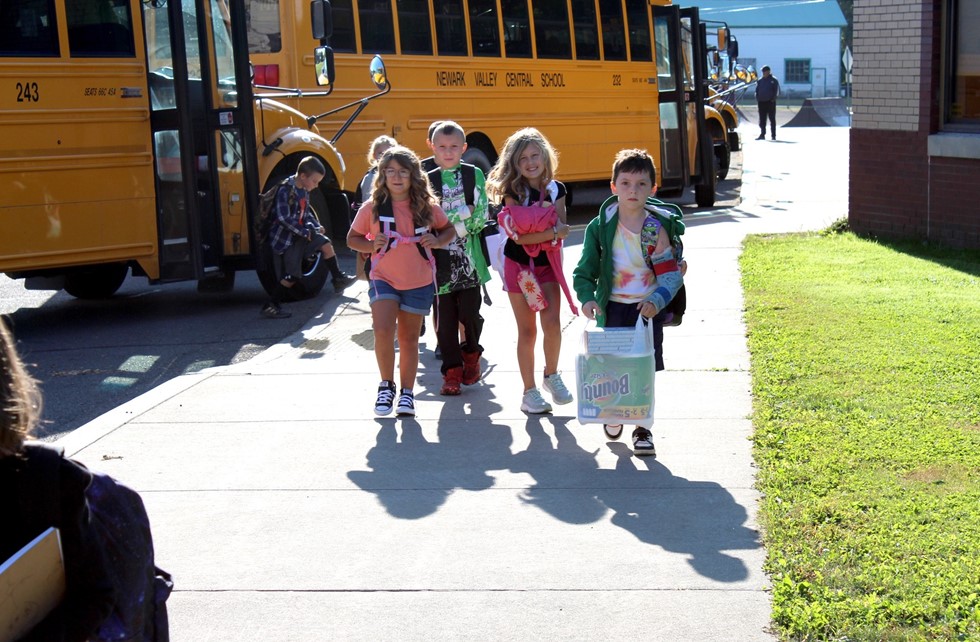 Kids getting off bus on first day