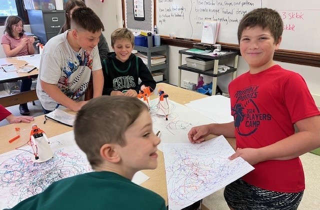 Students with artwork