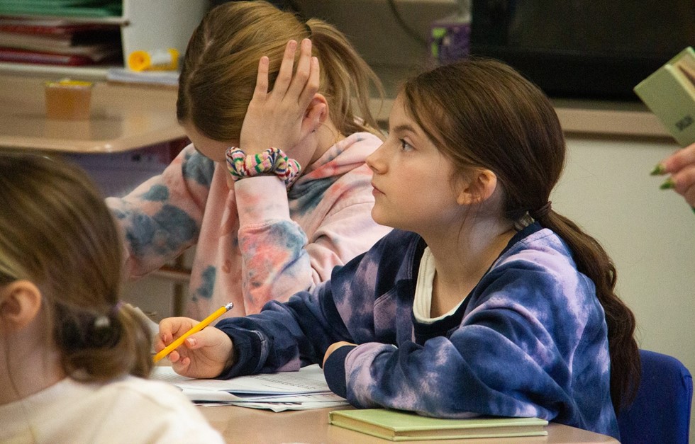 Students taking notes in class