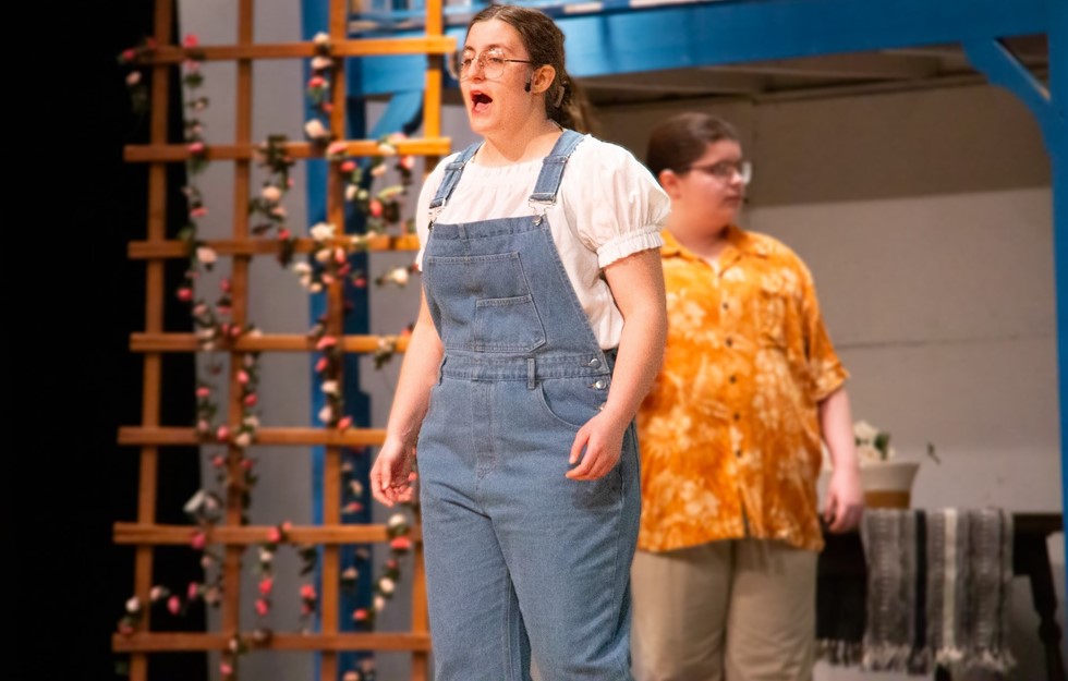 Student actor singing in musical