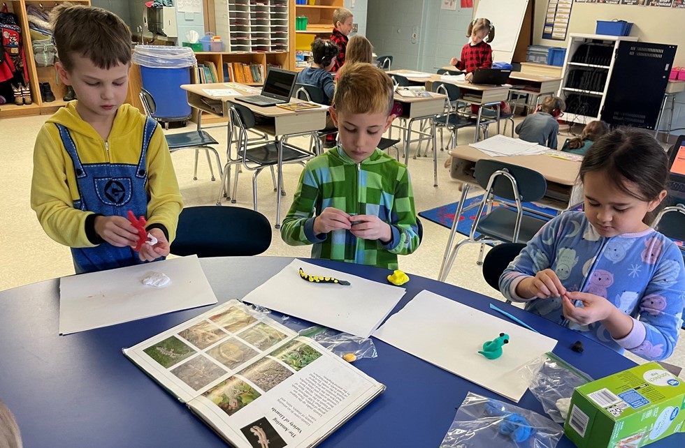 Students working on a clay art project