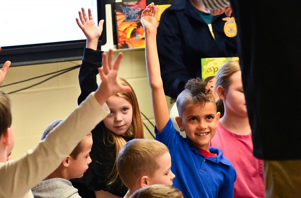 Students raising their hands
