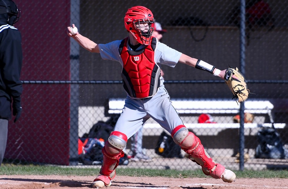 Catcher throwing down to second base