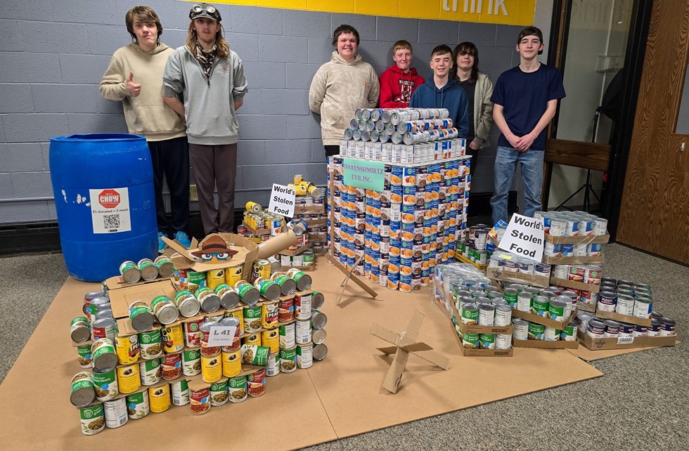 Engineering students with a canned food structure